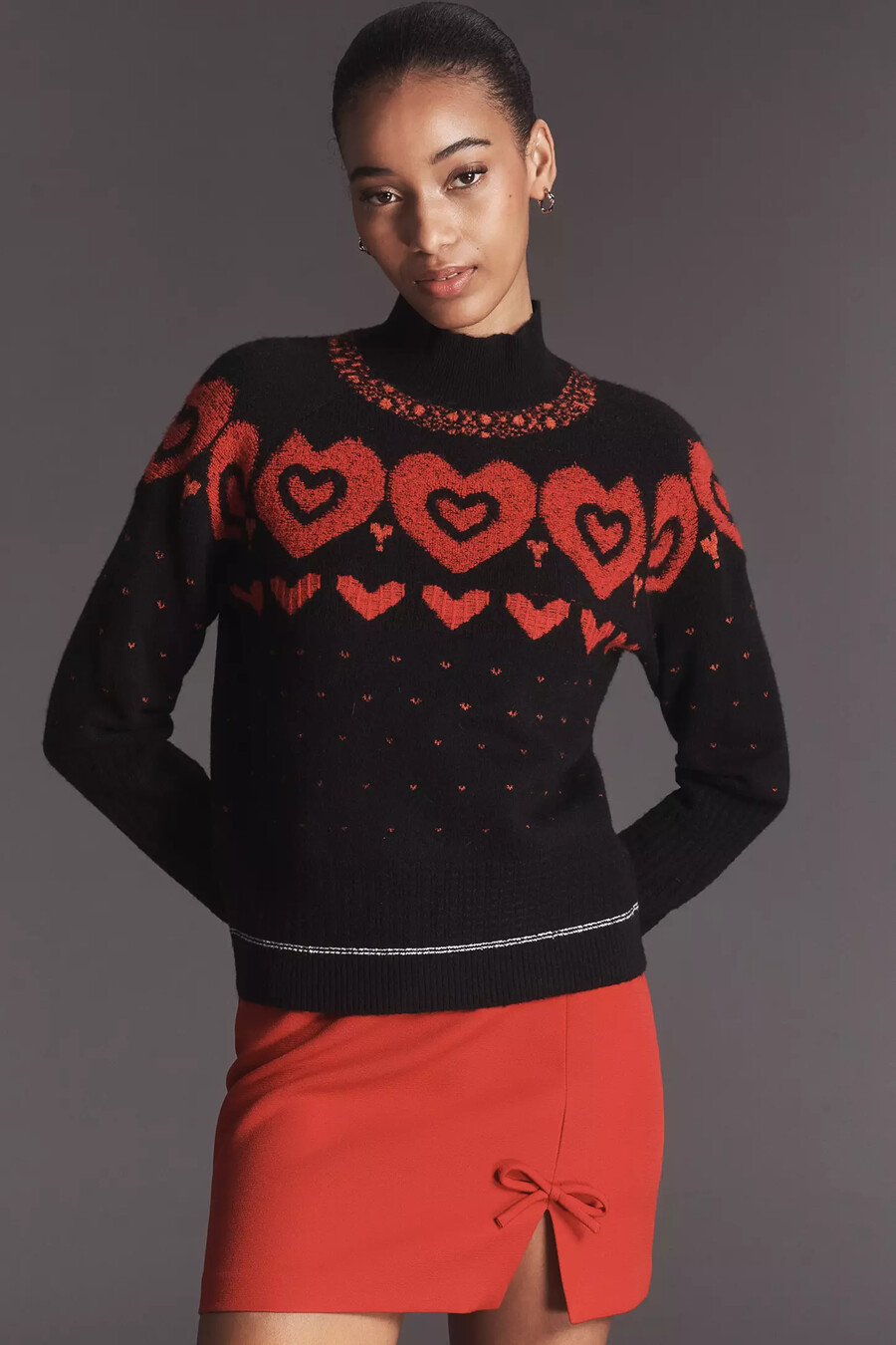 maeve pullover mit stehkragen und metallischem herzmotiv