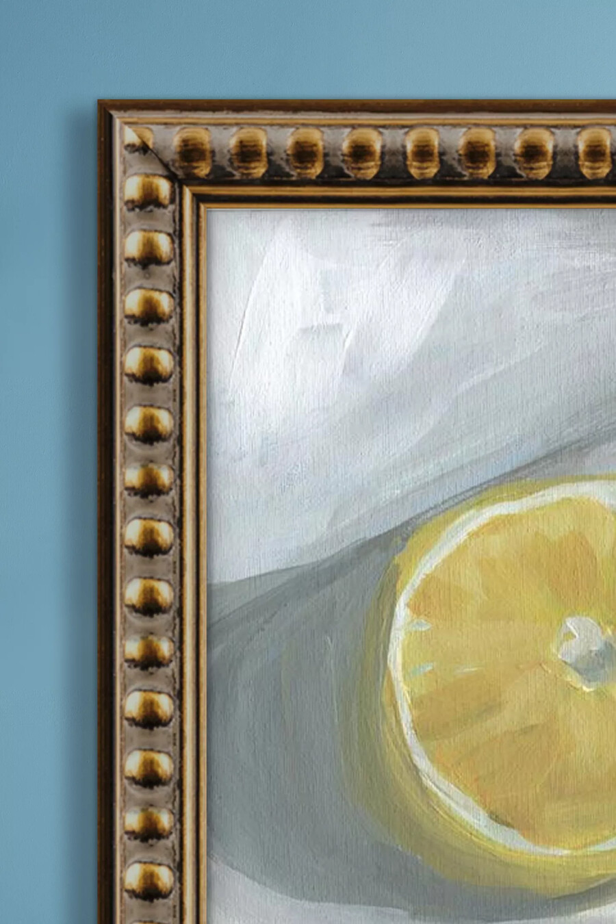 gerahmtes wandbild mit zitronenscheibe