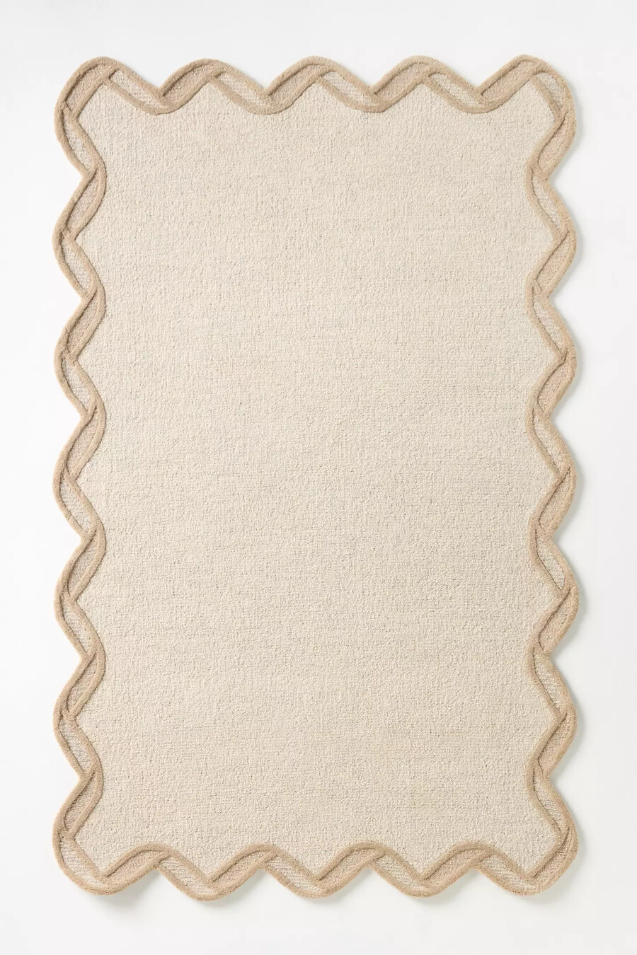 gesteppter wollteppich mit muschelkante
