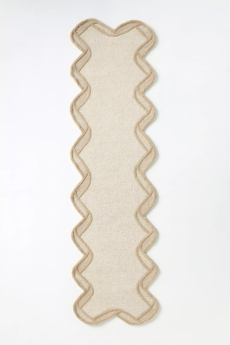 gesteppter wollteppich mit muschelkante
